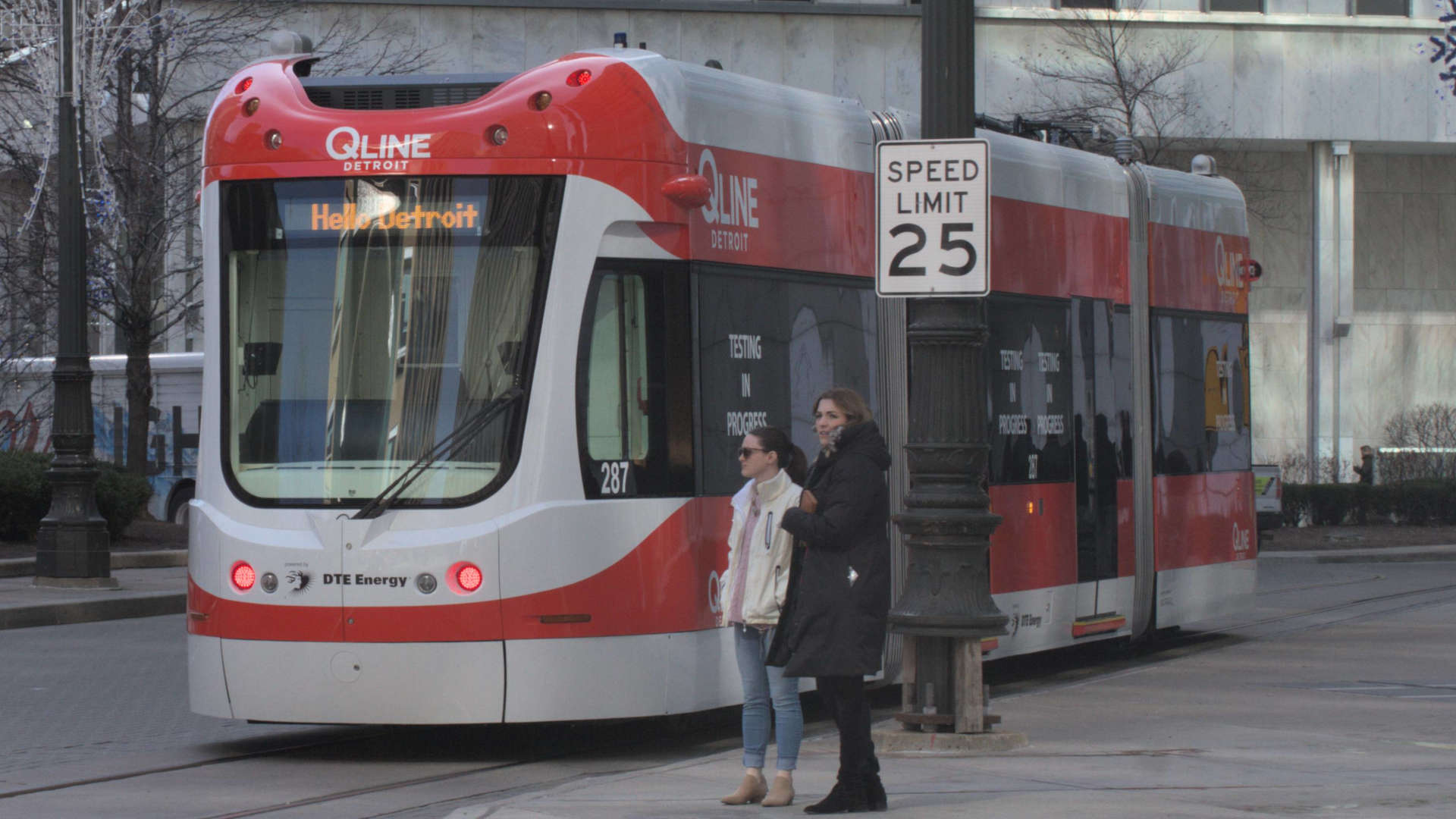 A Qline streetcar moves up Woodward Avenue near Campus Martius in downtown Detroit.