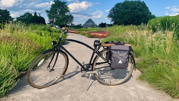 A black city bike on a pathway in the Oudolf Garden designed by Piet Oudolf at Belle Isle Park in Detroit.